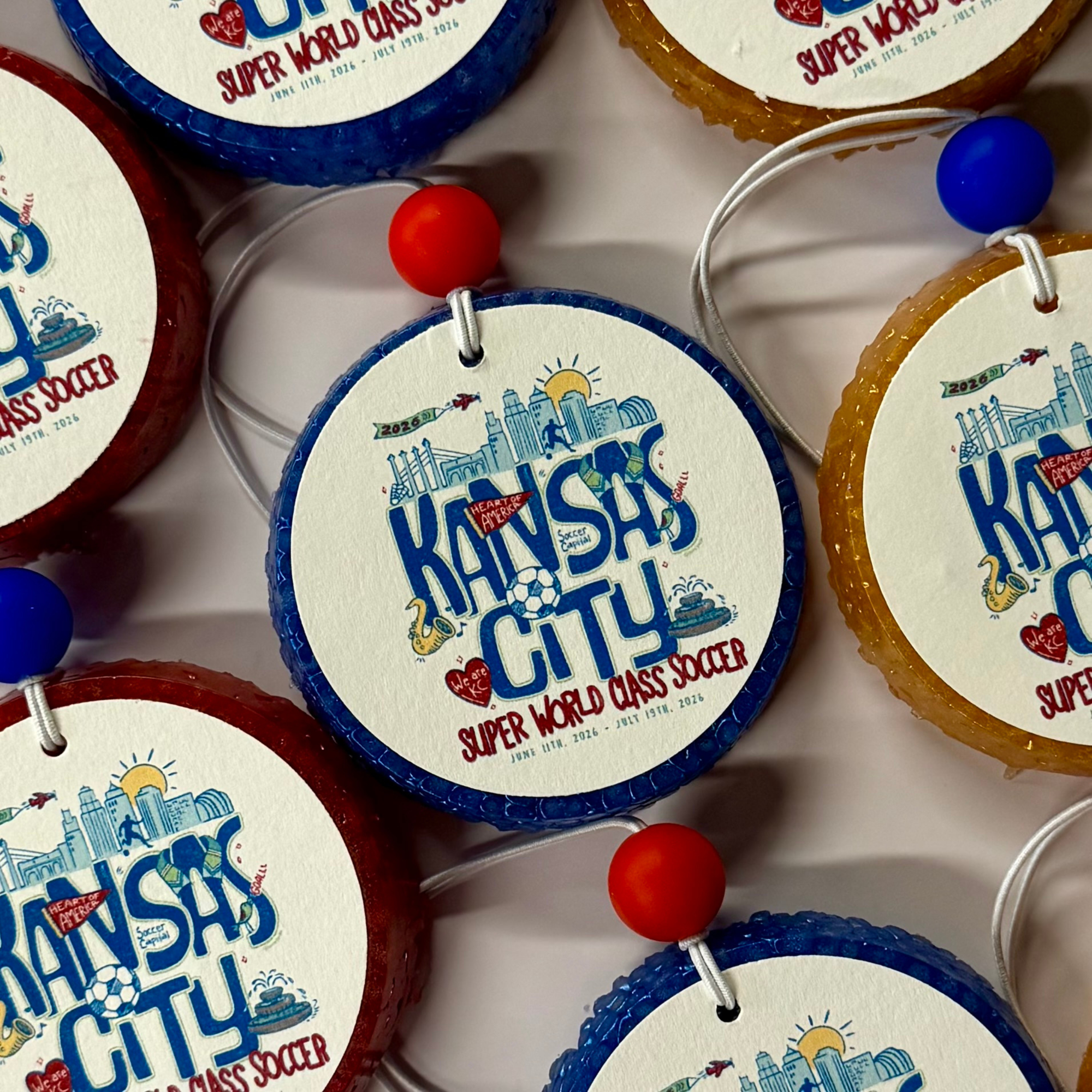 Decorative ornaments with 'Kansas City' text and graphics on a white surface