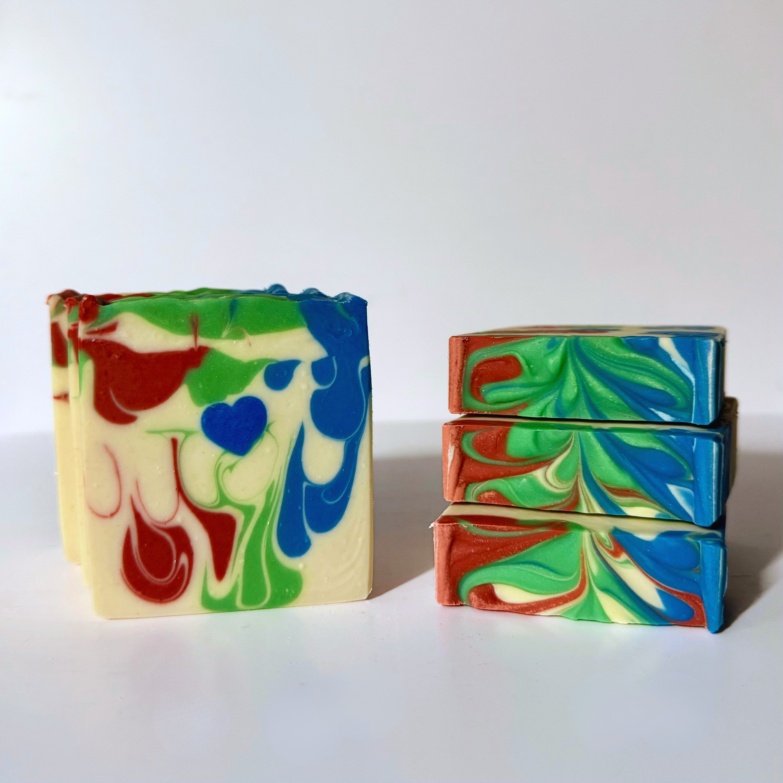 Colorful swirled soap bars on a white background