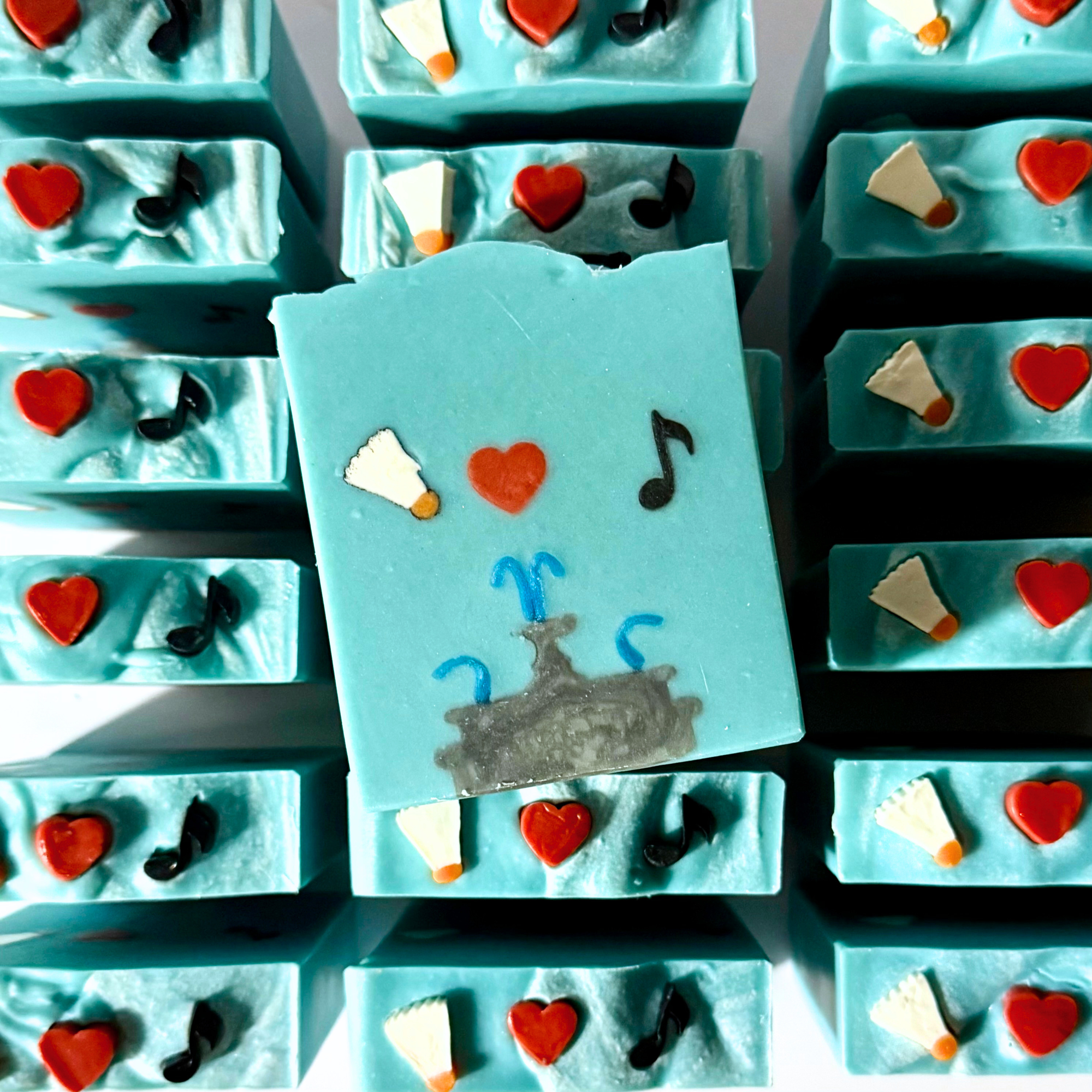 Blue soap bars with decorative elements on a white background
