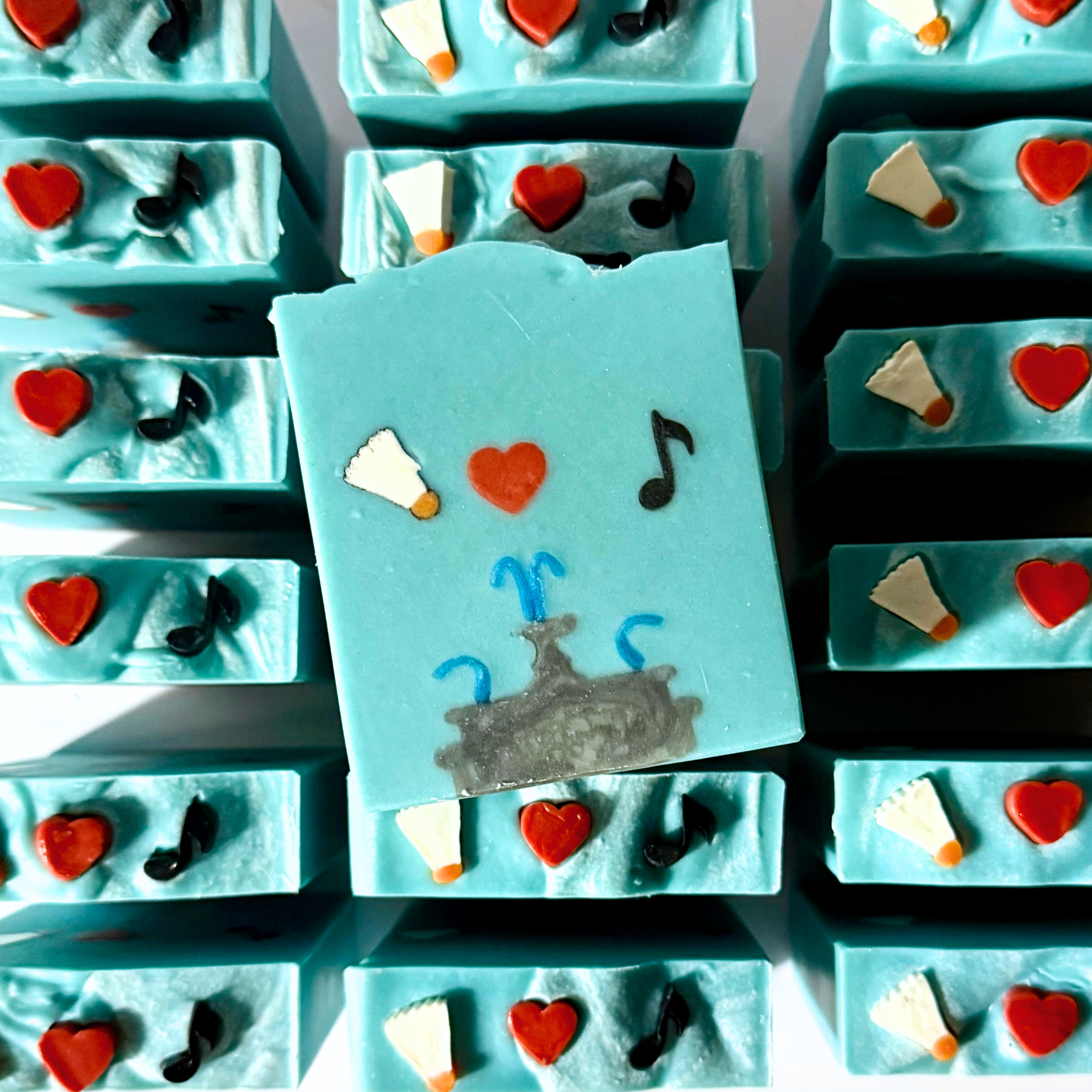 Blue soap bars with decorative elements on a white background