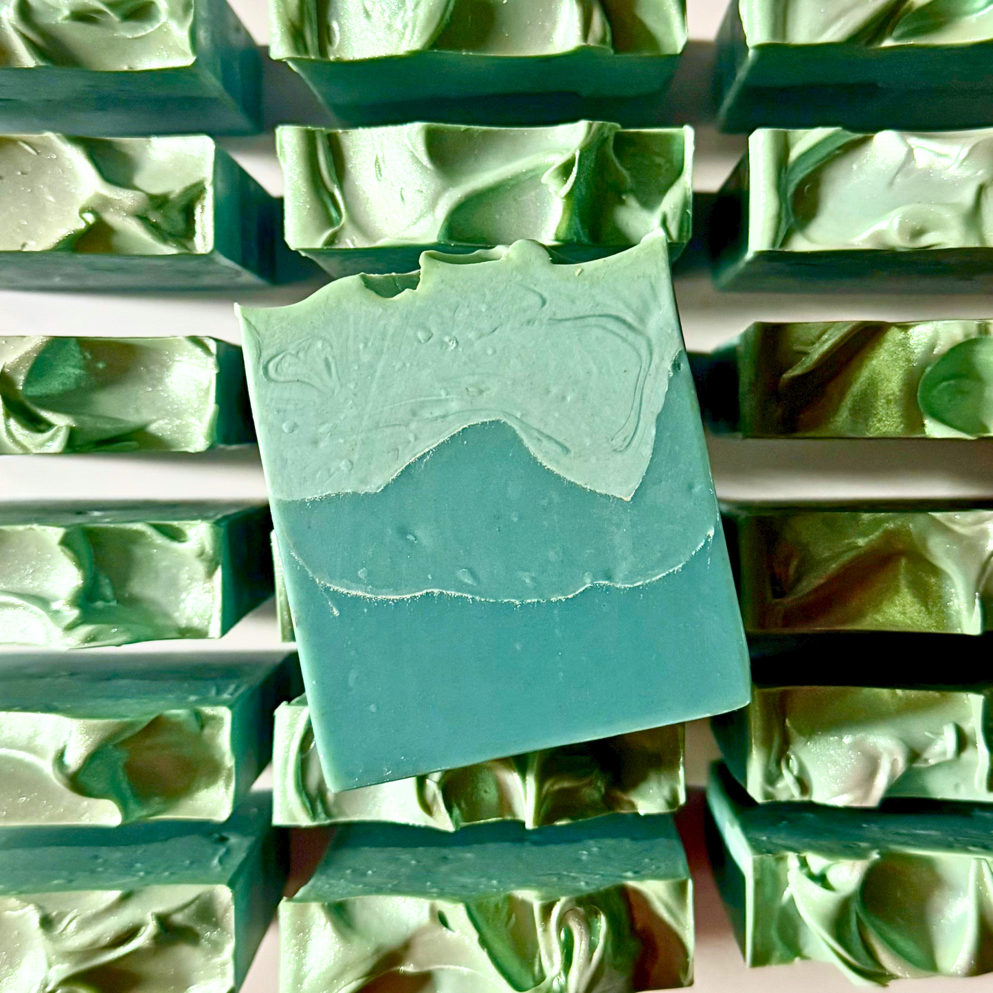 Green soap bars on a soap dish with a close-up view