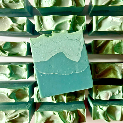 Green soap bars on a soap dish with a close-up view