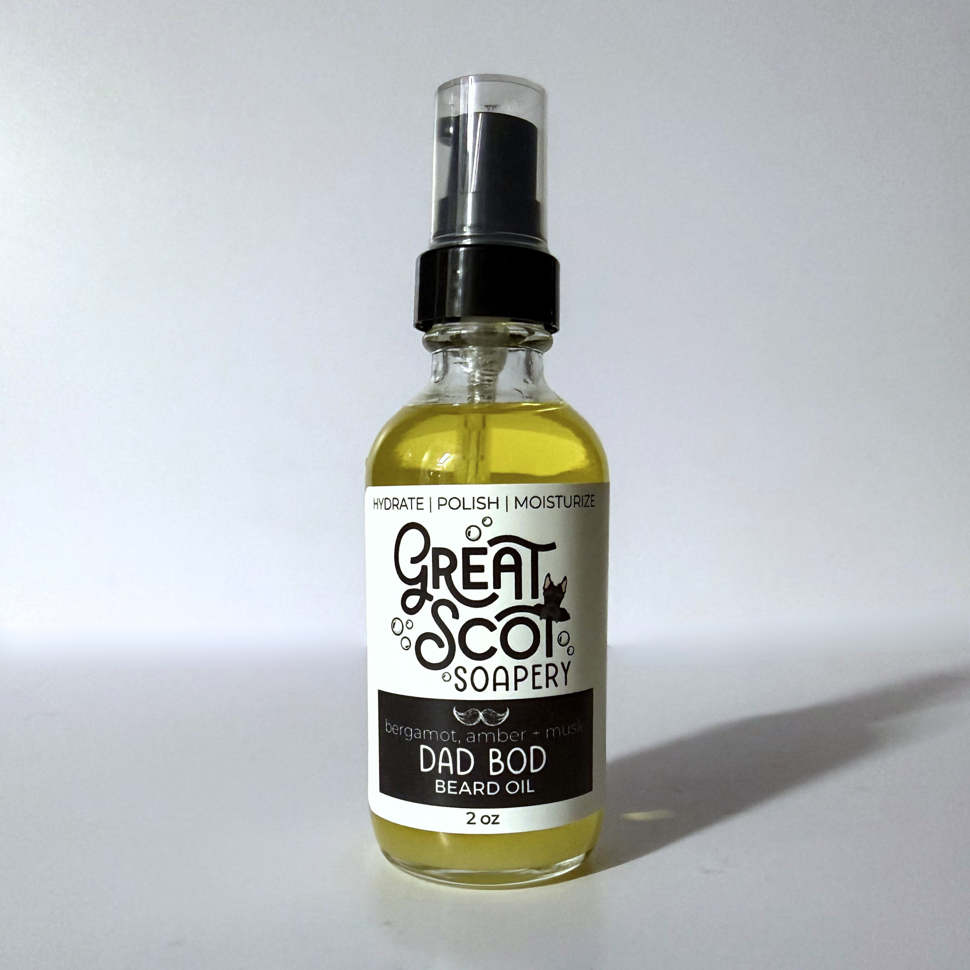 Bottle of 'Dad Bod' beard oil with a label on a white background