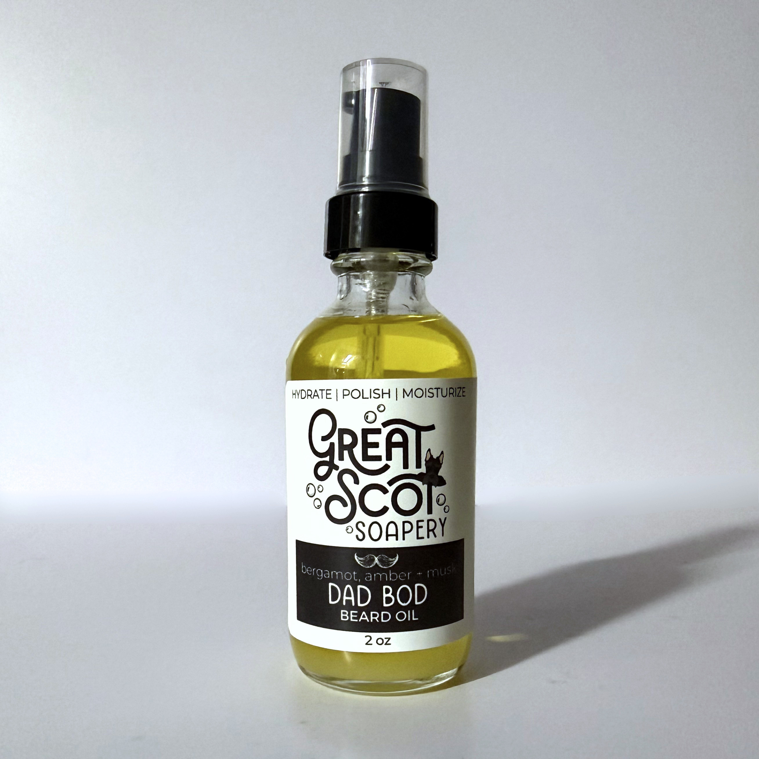 Bottle of 'Dad Bod' beard oil with a label on a white background